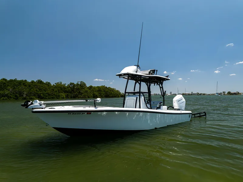 Slide: The Image of 2020 Barker Boatworks 26 in calm waters under clear blue sky. - 2