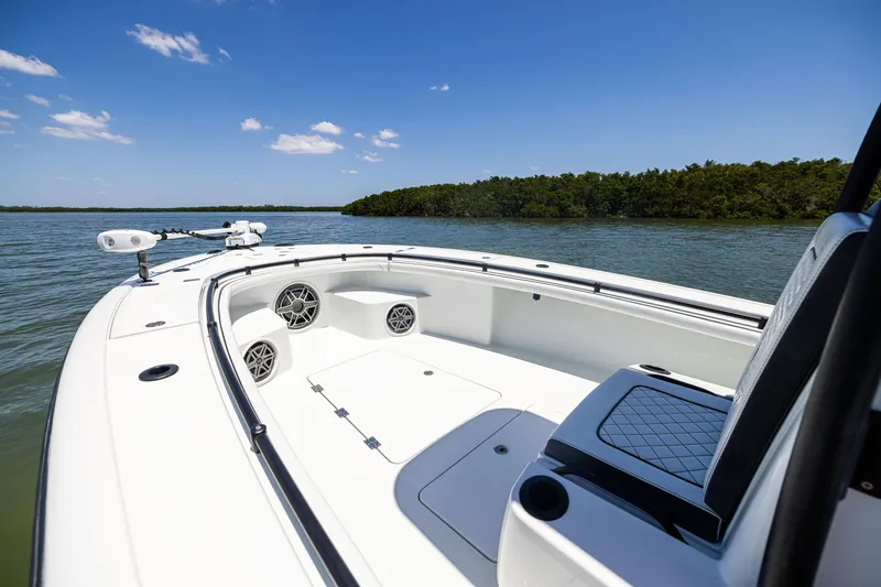 Slide: The Image of 2020 Barker Boatworks 26 on calm water, featuring sleek design and spacious seating. - 21