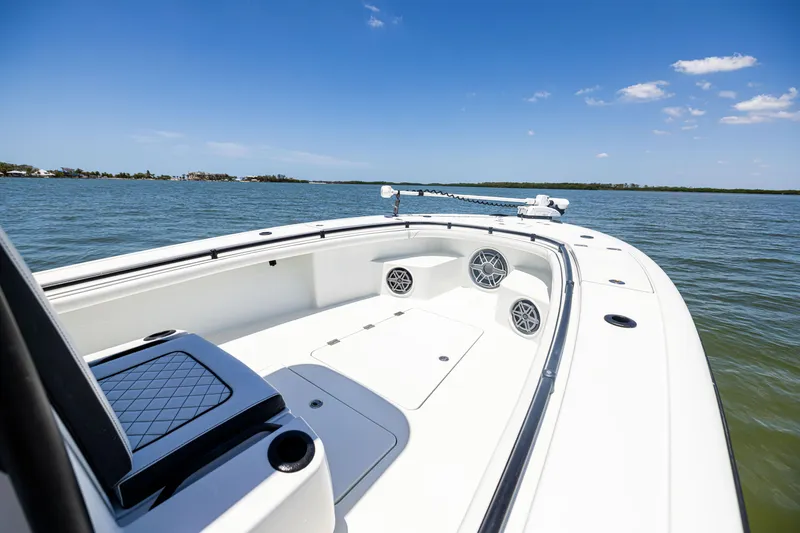 Slide: The Image of 2020 Barker Boatworks 26 on calm water under clear blue sky. - 23