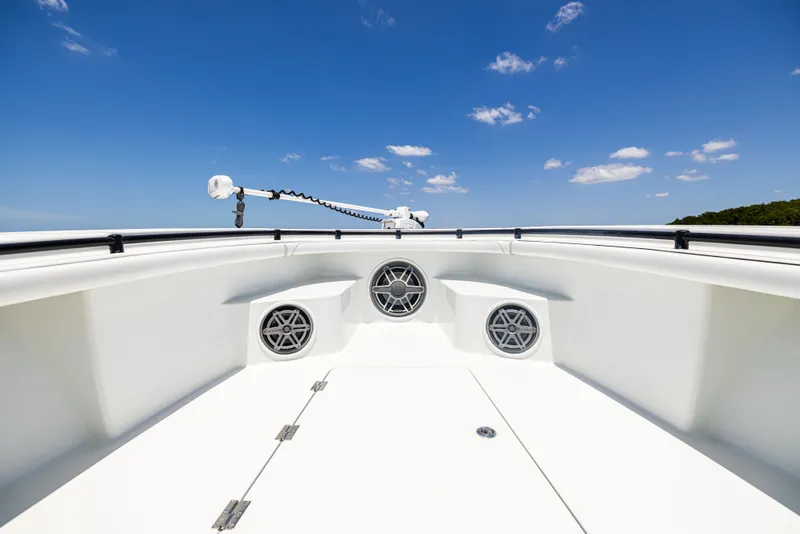 Slide: The Image of 2020 Barker Boatworks 26, white deck, clear blue sky, marine speakers, open water view. - 24