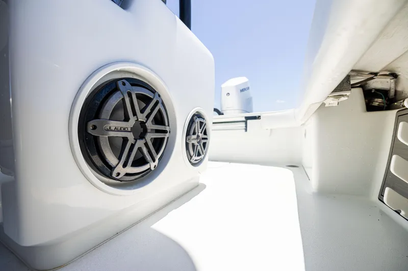 Slide: The Image of 2020 Barker Boatworks 26 interior with speakers and clean white deck. - 26