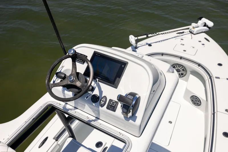 Slide: The Image of Barker Boatworks 26, 2020 model, helm view with steering wheel and controls. - 28