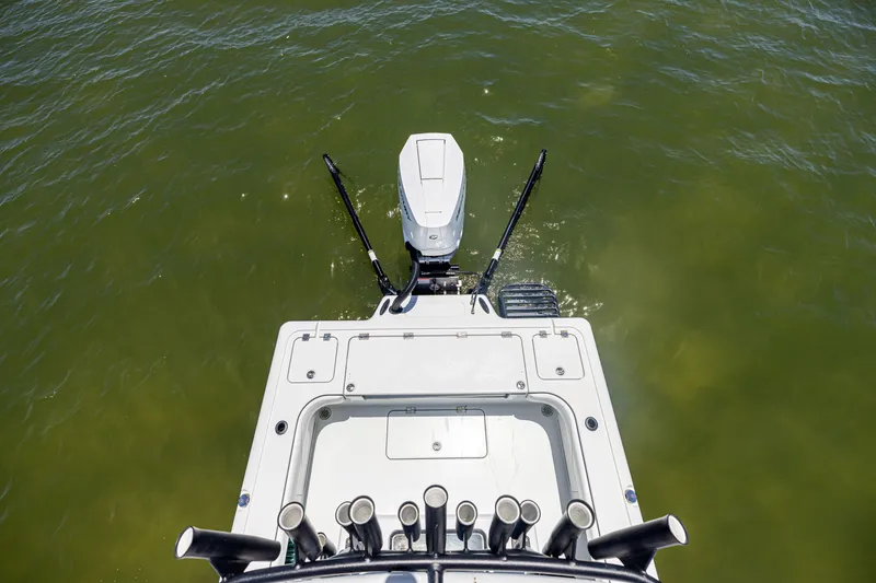 Slide: The Image of 2020 Barker Boatworks 26, aerial view of deck and motor on green water. - 30