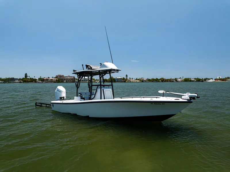 Slide: The Image of 2020 Barker Boatworks 26 on calm water under clear blue sky. - 4