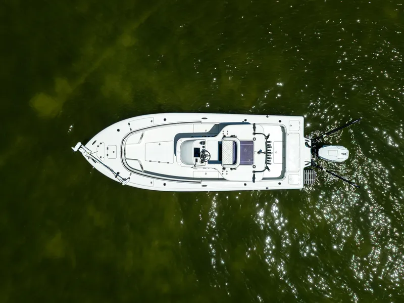 Slide: The Image of Aerial view of 2020 Barker Boatworks 26 on green water. - 5
