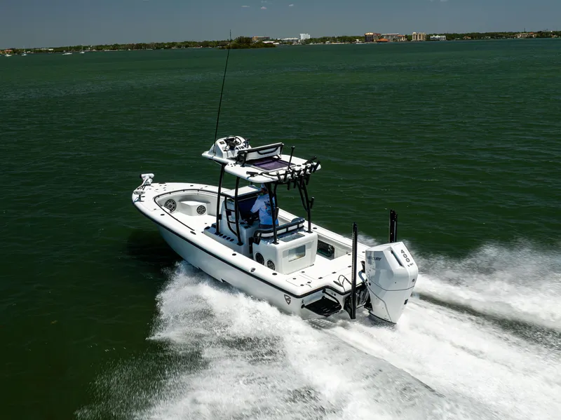 Slide: The Image of 2020 Barker Boatworks 26 cruising on open water, showcasing sleek design and powerful performance. - 7