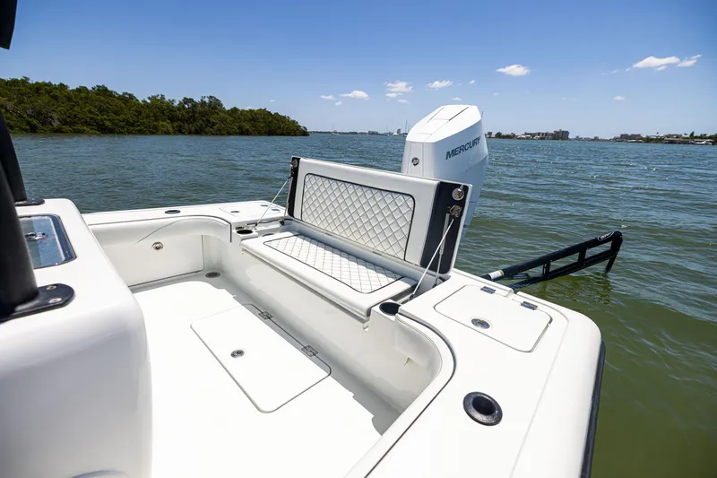 Slide: The Image of 2020 Barker Boatworks 26 on water, featuring Mercury engine, sunny day, scenic view. - 9