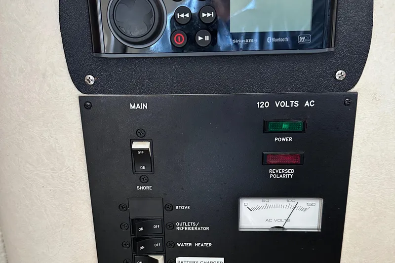 Slide: The Image of Electrical control panel on a 2002 Sea Ray 240 Sundancer boat. - 19