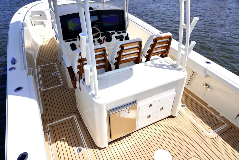 Slide: The Image of 2020 Cobia 350 Center Console boat with teak deck and modern helm station. - 18