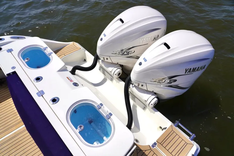 Slide: The Image of 2020 Cobia 350 Center Console with twin Yamaha outboard engines on water. - 23