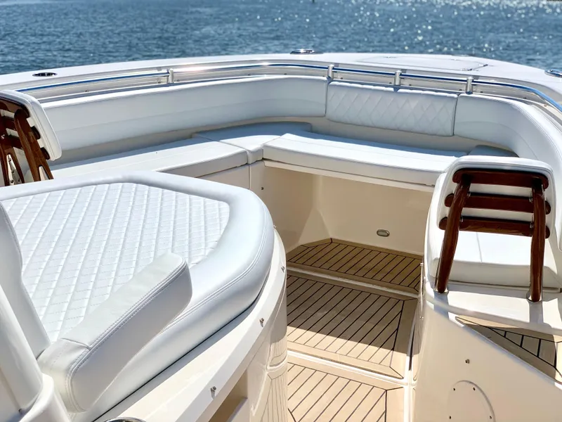 Slide: The Image of 2020 Cobia 350 Center Console boat with luxurious seating and ocean view. - 6