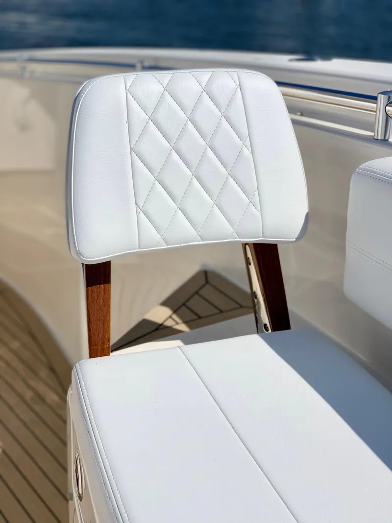Slide: The Image of Luxury seating on 2020 Cobia 350 Center Console boat with diamond-stitched upholstery. - 7