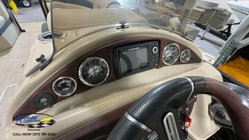 Slide: The Image of Dashboard of 2020 Berkshire STS Entertainment 25 boat with gauges and navigation system. - 11