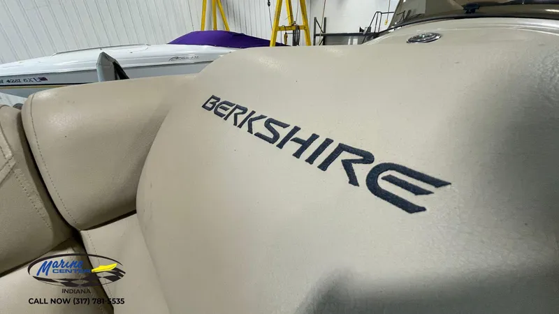 Slide: The Image of 2020 Berkshire STS Entertainment 25 boat interior with logo, displayed at Marine Center Indiana. - 13