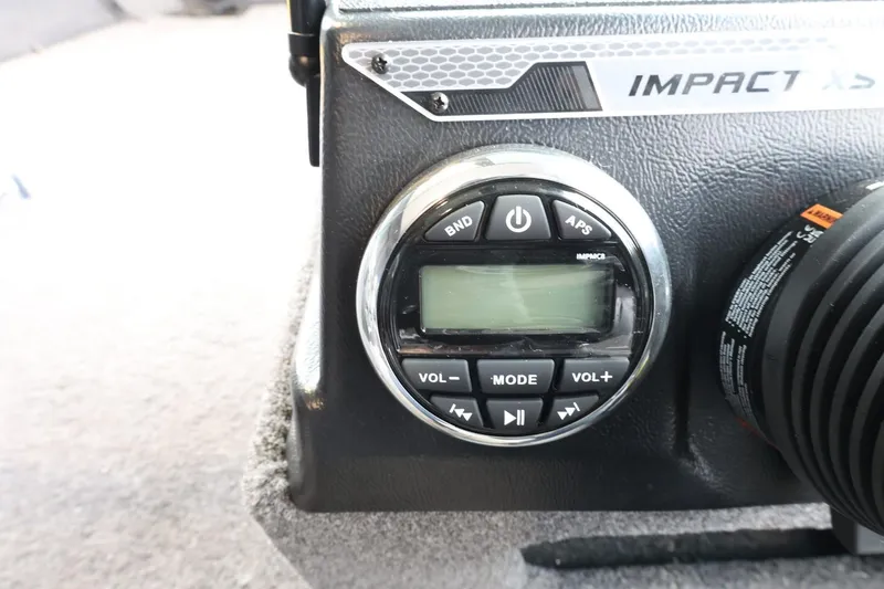 Slide: The Image of Control panel of 2025 Lund 1875 Impact XS Sport boat, featuring audio system controls. - 20