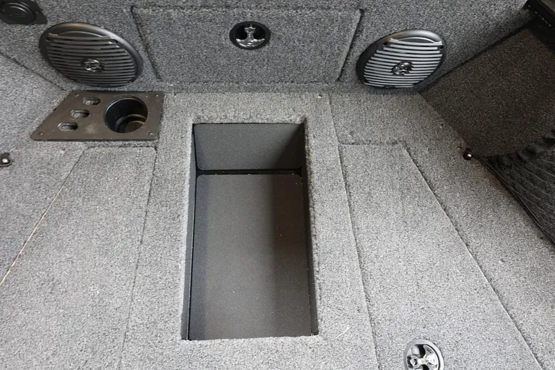 Slide: The Image of 2025 Lund 1875 Impact XS Sport boat interior with speakers and storage compartment. - 31