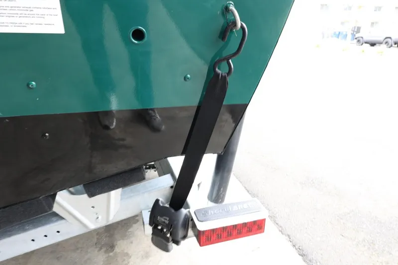 Slide: The Image of 2025 Lund 1875 Impact XS Sport boat trailer with safety strap and light. - 37