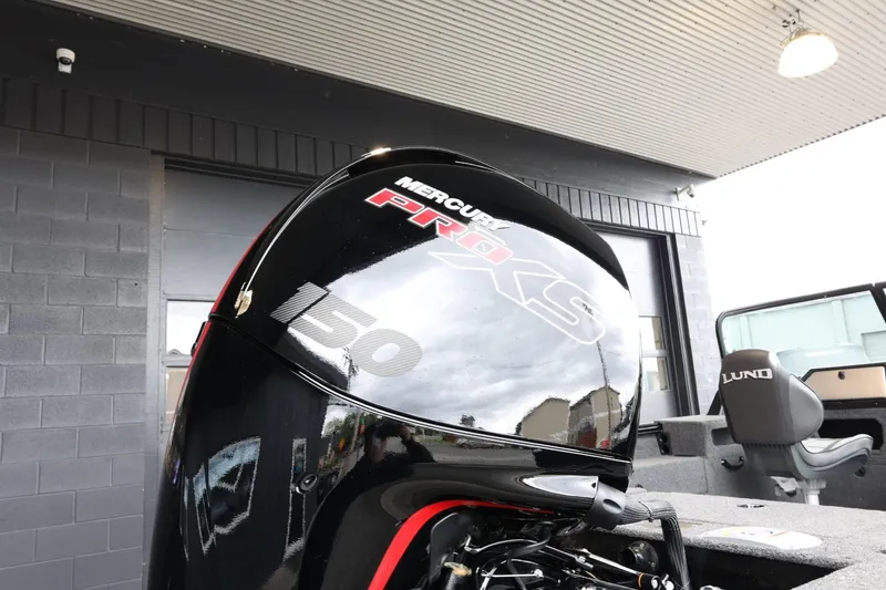 Slide: The Image of 2025 Lund 1875 Impact XS Sport with Mercury Pro XS 150 engine, outdoor display. - 8