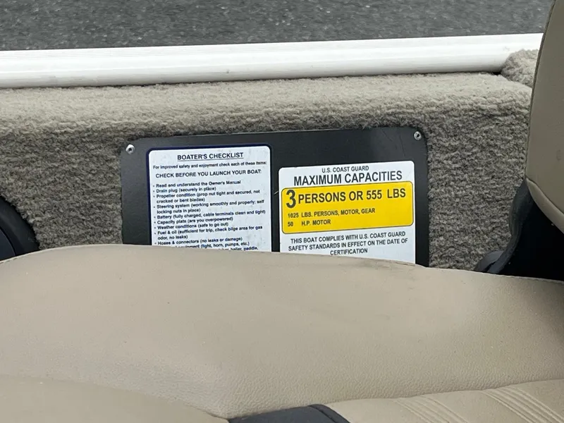 Slide: The Image of 2022 Tracker Bass Tracker Classic XL capacity label, seating, and safety checklist. - 11