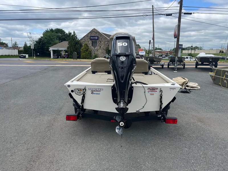 Slide: The Image of 2022 Tracker Bass Tracker Classic XL boat with 50 HP motor, parked outdoors. - 7