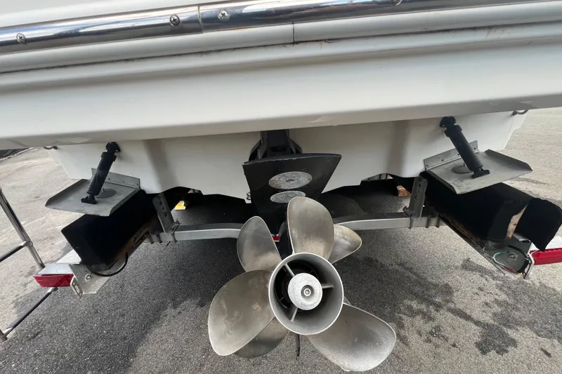 Slide: The Image of 2014 Sea Ray 260 Sundancer helm with steering wheel and control panel. - 13