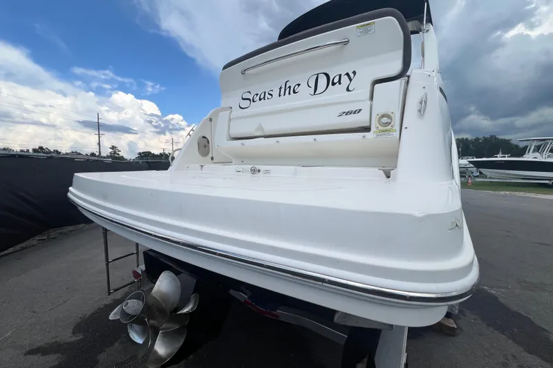 Slide: The Image of Dashboard of a 2014 Sea Ray 260 Sundancer boat with steering wheel and gauges. - 14