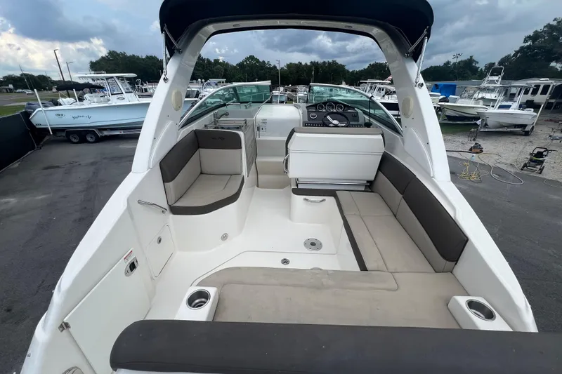 Slide: The Image of 2014 Sea Ray 260 Sundancer boat kitchenette with sink and stove. - 15