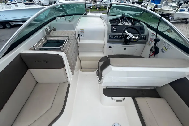 Slide: The Image of 2014 Sea Ray 260 Sundancer boat kitchenette with sink and stove. - 16