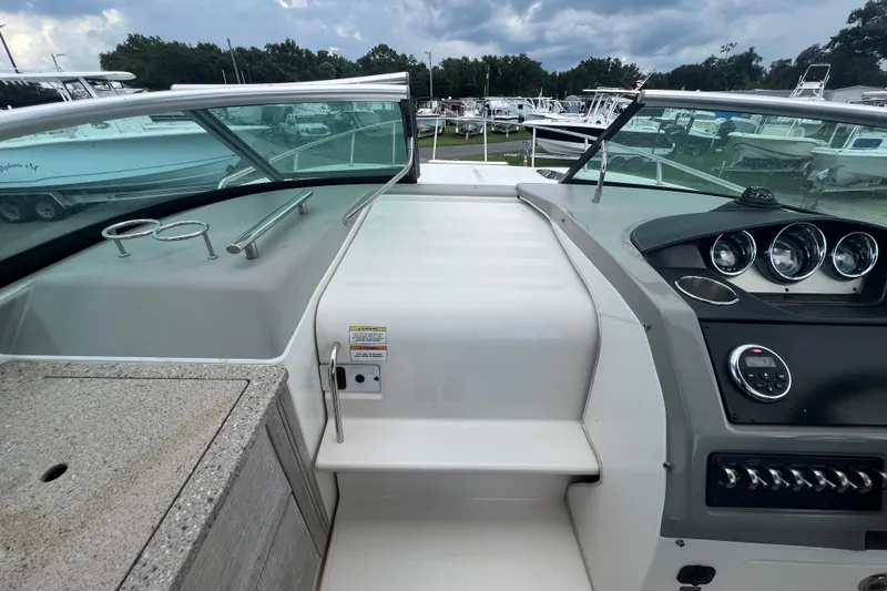 Slide: The Image of Interior view of 2014 Sea Ray 260 Sundancer cabin with kitchenette and seating area. - 22