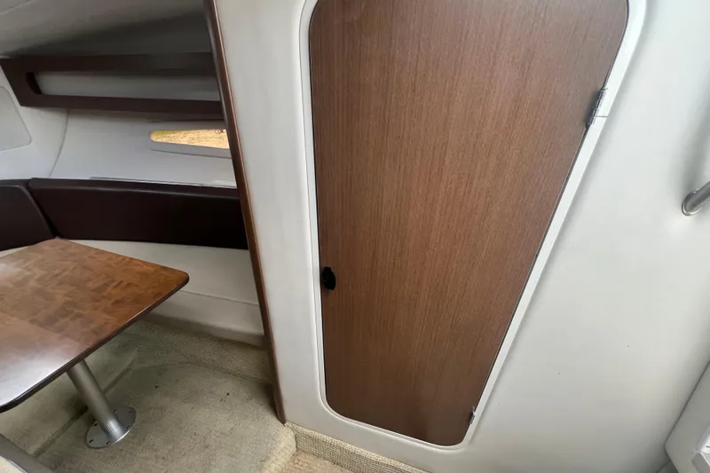 Slide: The Image of Interior view of 2014 Sea Ray 260 Sundancer boat, showing cabin and seating area. - 29