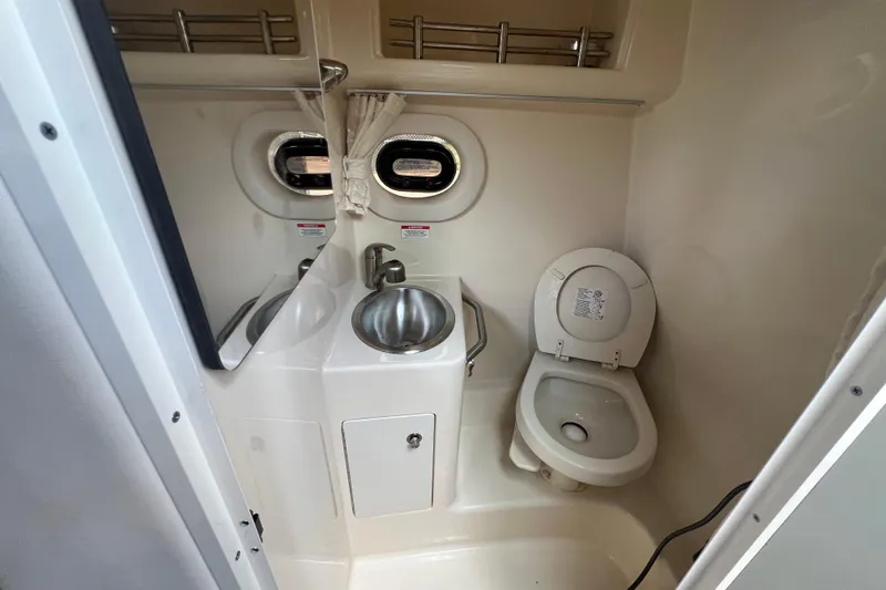 Slide: The Image of Interior view of 2014 Sea Ray 260 Sundancer boat with seating and storage. - 30