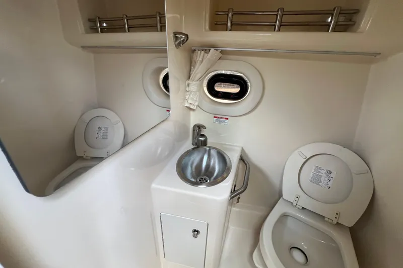 Slide: The Image of Interior of 2014 Sea Ray 260 Sundancer boat with seating and kitchenette area. - 31