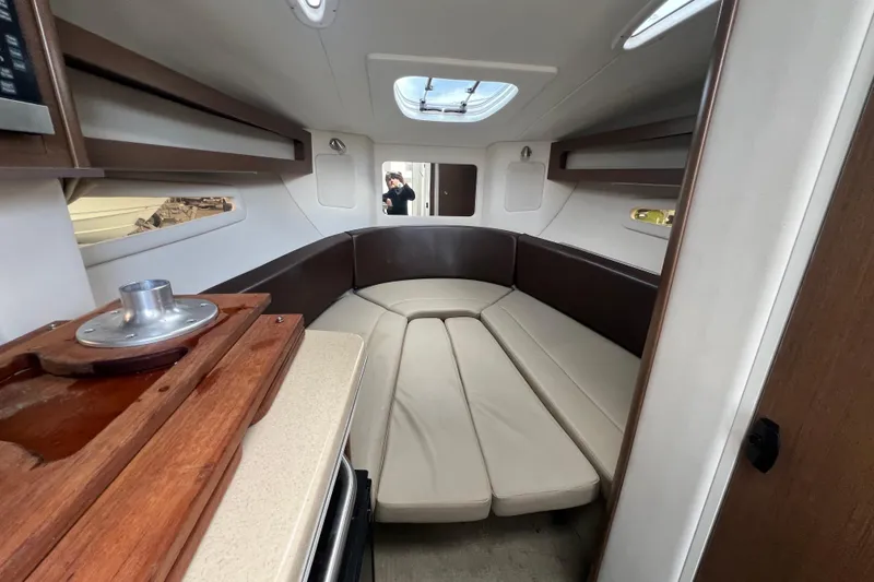 Slide: The Image of 2014 Sea Ray 260 Sundancer boat deck with storage compartments open. - 33