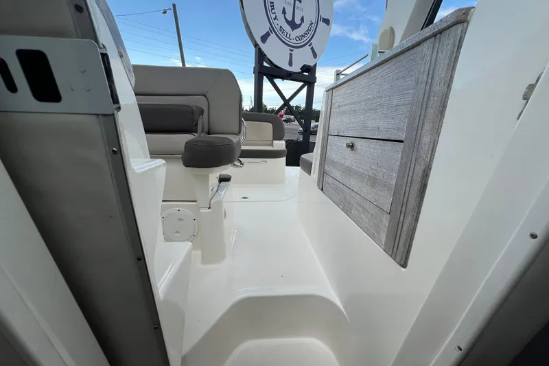 Slide: The Image of Engine compartment of a 2014 Sea Ray 260 Sundancer boat, featuring a MerCruiser 350 engine. - 35