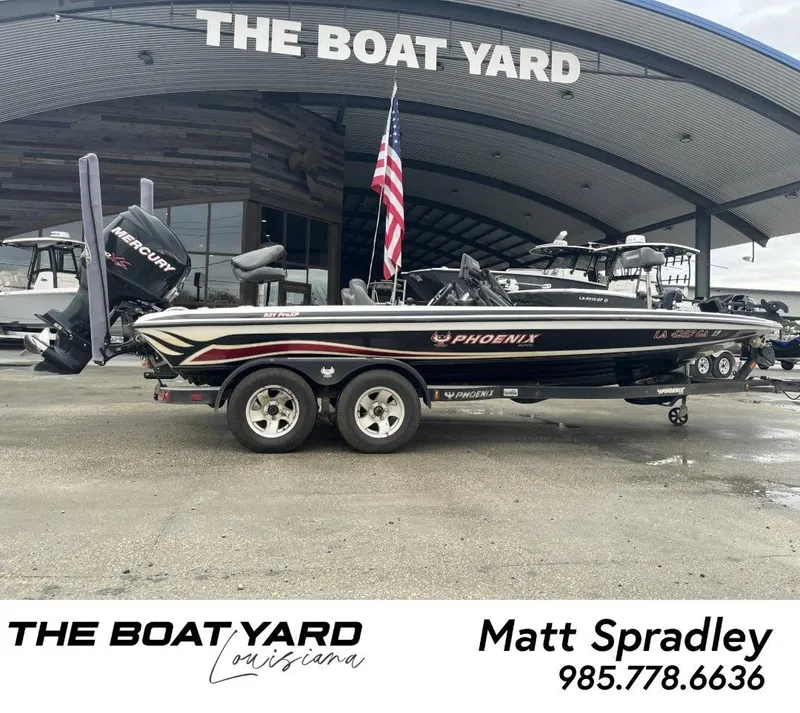 Slide: The Image of 2012 Phoenix 921 PRO XP boat at The Boat Yard, Louisiana, with Mercury engine. - 1
