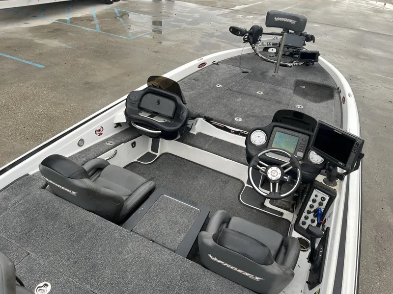 Slide: The Image of 2012 Phoenix 921 PRO XP boat interior with steering console and seating. - 13