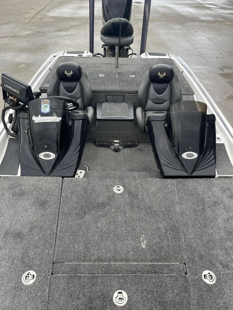 Slide: The Image of 2012 Phoenix 921 PRO XP boat interior with dual seats and control panels. - 18