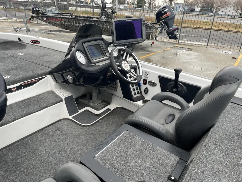 Slide: The Image of 2012 Phoenix 921 PRO XP boat interior with steering console and seating. - 20