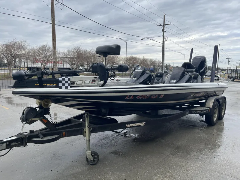 Slide: The Image of 2012 Phoenix 921 PRO XP boat on trailer in parking lot, overcast sky. - 4