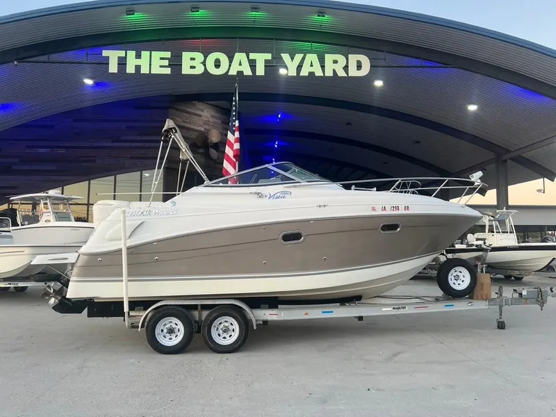 Slide: The Image of 2004 Four Winns 248 Vista boat on trailer at The Boat Yard dealership. - 0