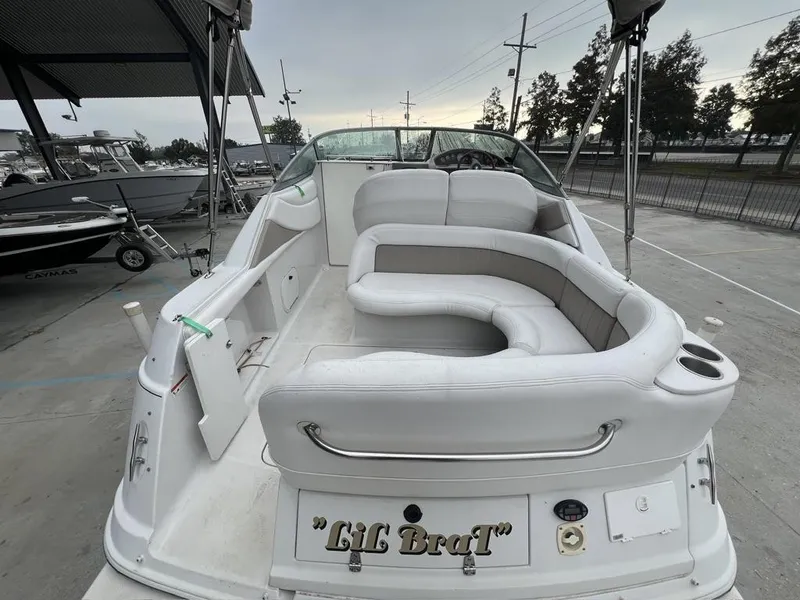 Slide: The Image of 2004 Four Winns 248 Vista boat with white seating and "Lil Brat" nameplate. - 11