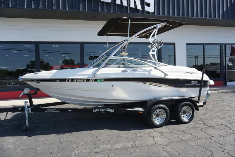 Slide: The Image of 2006 Chaparral SSi 190 boat on trailer, parked outside a building. - 10