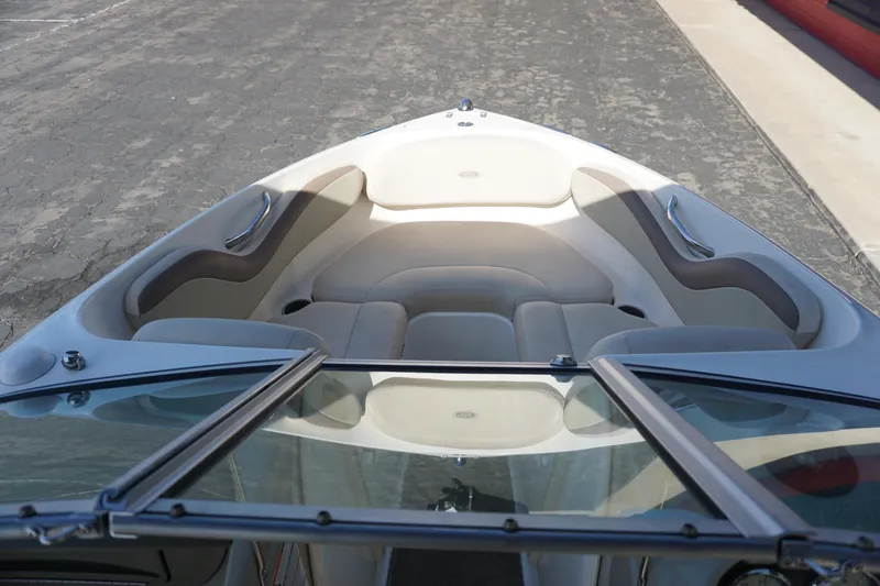 Slide: The Image of 2006 Chaparral SSi 190 boat interior with cushioned seating and open windshield. - 14
