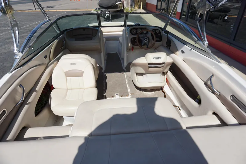 Slide: The Image of 2006 Chaparral SSi 190 boat interior with beige seating and steering wheel. - 6