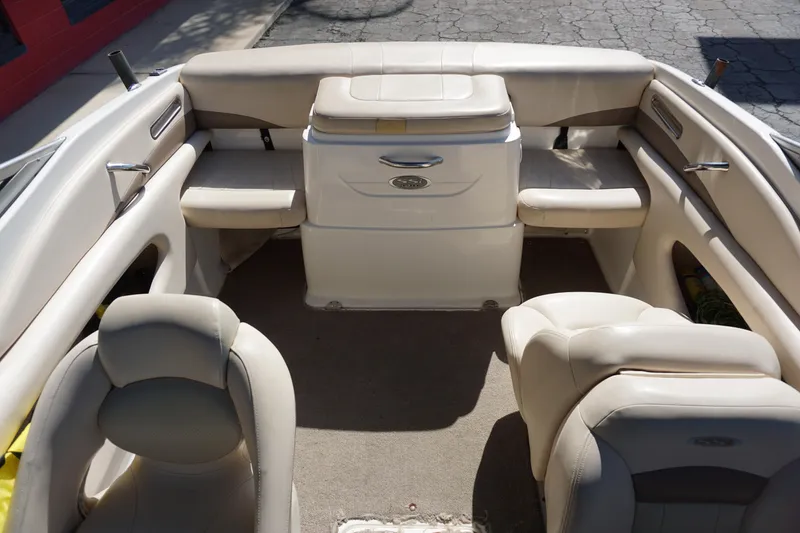 Slide: The Image of Interior of a 2006 Chaparral SSi 190 boat with beige seating and carpet. - 8