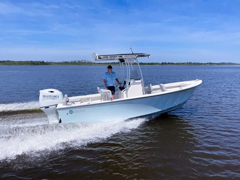 Slide: The Image of 2025 May-Craft 208 CC boat cruising on a calm lake with a Suzuki engine. - 1