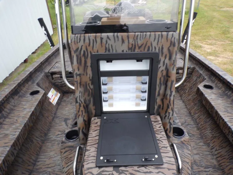 Slide: The Image of 2025 Xpress H20BAY boat interior with camouflage design and storage compartment. - 10