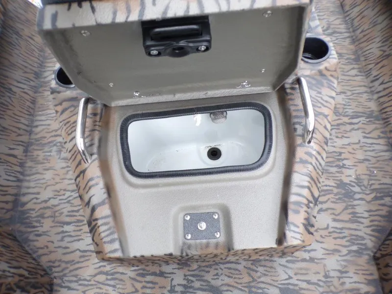 Slide: The Image of Open storage compartment in 2025 Xpress H20BAY boat with camouflage pattern. - 11