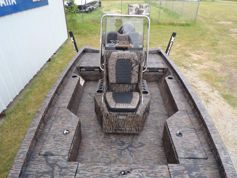 Slide: The Image of 2025 Xpress H20BAY boat with camouflage design, featuring central seating and storage compartments. - 17
