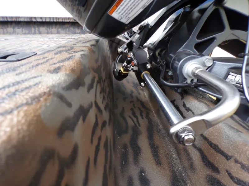Slide: The Image of 2025 Xpress H20BAY boat with camo pattern and detailed motor components. - 19